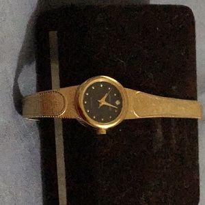 Pierre Cardin ladies watch with adjustable band.